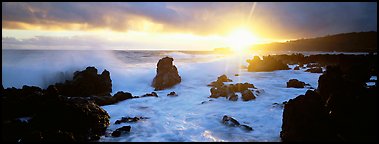 Primeval seascape with surf and rising sun. Maui, Hawaii, USA (Panoramic color)
