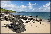 Volcanic rocks and beach, near Makai research pier,  early morning. Oahu island, Hawaii, USA ( color)