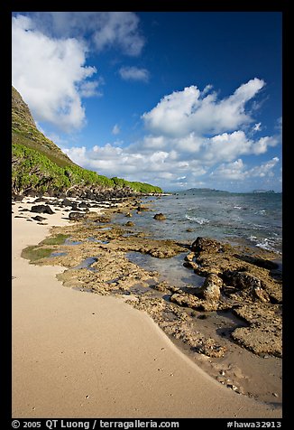 Beach and rocks near Makai research pier,  early morning. Oahu island, Hawaii, USA