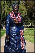 Statue of queen with fresh flower leis. Waikiki, Honolulu, Oahu island, Hawaii, USA (color)