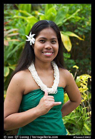 Tahitian woman making the traditional welcome gesture. Polynesian Cultural Center, Oahu island, Hawaii, USA (color)