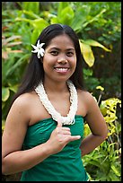 Tahitian woman making the traditional welcome gesture. Polynesian Cultural Center, Oahu island, Hawaii, USA