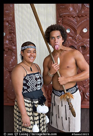Maori woman and man sticking out his tongue. Polynesian Cultural Center, Oahu island, Hawaii, USA (color)