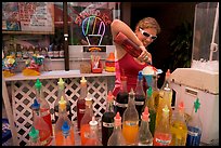 Woman preparing a cup of shave ice. Waikiki, Honolulu, Oahu island, Hawaii, USA (color)