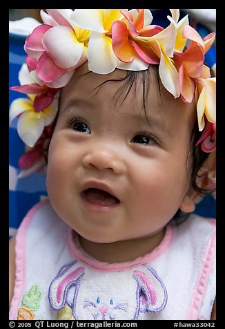 Baby girl wearing a flower lei on her head. Waikiki, Honolulu, Oahu island, Hawaii, USA
