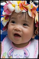 Baby girl wearing a flower lei on her head. Waikiki, Honolulu, Oahu island, Hawaii, USA (color)