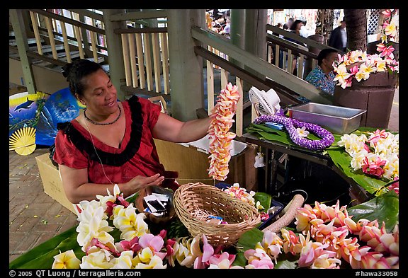 Woman showing  a fresh flower lei, International Marketplace. Waikiki, Honolulu, Oahu island, Hawaii, USA