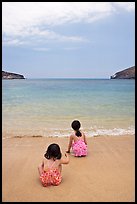 Two girls at the edge of water, Hanauma Bay. Oahu island, Hawaii, USA ( color)
