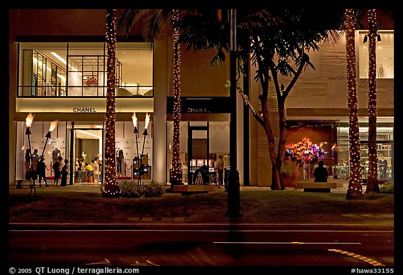 Shopping section of Kalakaua avenue at night. Waikiki, Honolulu, Oahu island, Hawaii, USA