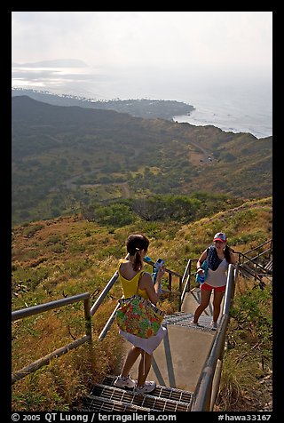 Tourists take a photo on the last steps of the Diamond Head crater summit trail. Oahu island, Hawaii, USA (color)