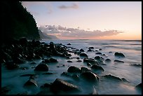 Boulders, surf, and Na Pali Coast, Kee Beach, dusk. Kauai island, Hawaii, USA