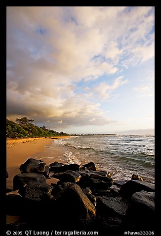 Boulders and beach, Lydgate Park, sunrise. Kauai island, Hawaii, USA (color)