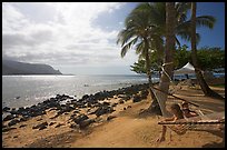 Family on Hammock, Puu Poa Beach. Kauai island, Hawaii, USA (color)
