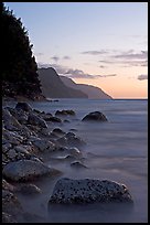 Boulders, surf, and Na Pali Coast, sunset. Kauai island, Hawaii, USA ( color)