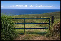 Gate, field, and Ocean. Big Island, Hawaii, USA