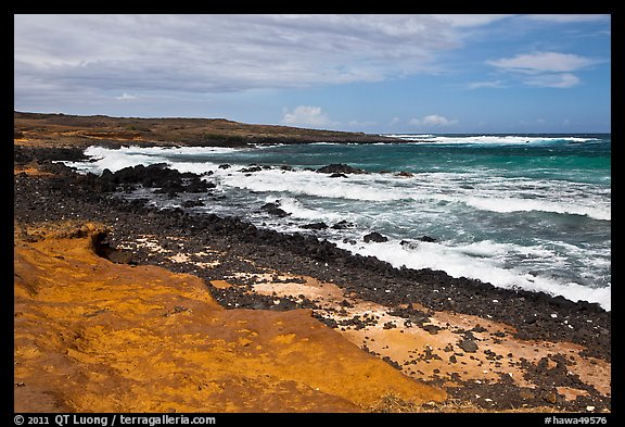 Colorful shale and ocean with surf, South Point. Big Island, Hawaii, USA