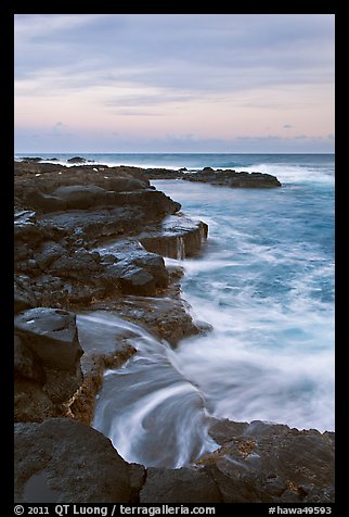 Surf and volcanic shore at sunset, South Point. Big Island, Hawaii, USA