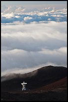 Astronomic radio antenna and sea of clouds. Mauna Kea, Big Island, Hawaii, USA (color)
