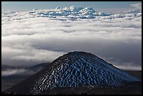 Dark cinder cone and sea of clouds. Mauna Kea, Big Island, Hawaii, USA (color)
