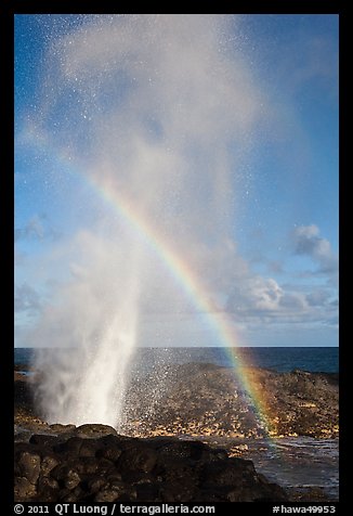 Spouting Horn with rainbow in spray. Kauai island, Hawaii, USA