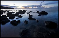 Boulders in water near Kalihika Park, sunset. Kauai island, Hawaii, USA (color)