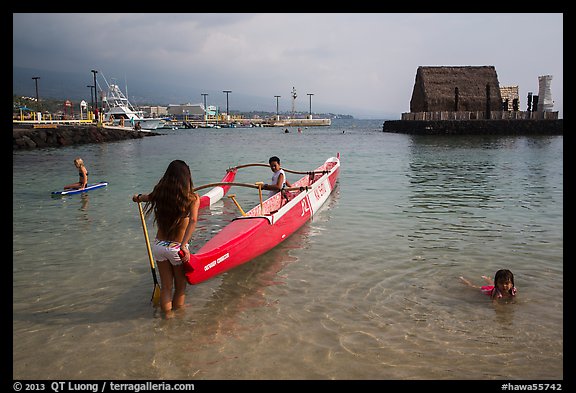 Girls, outrigger canoe, and Kamakahonu heiau, Kailua-Kona. Hawaii, USA (color)