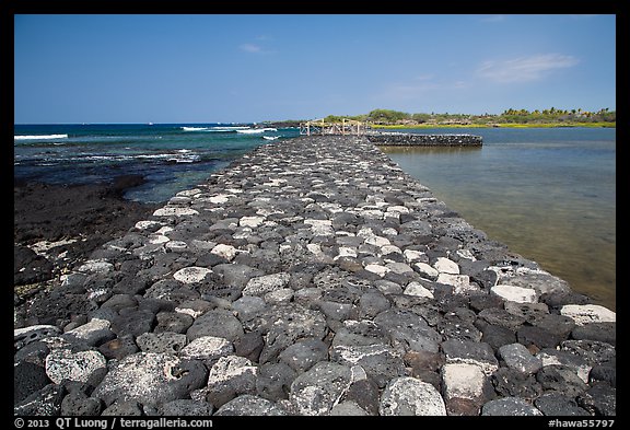Rock wall separating Kaloko fishpond from the ocean, Kaloko-Honokohau National Historical Park. Hawaii, USA (color)