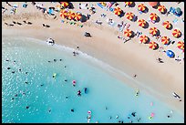 Aerial view of sun umbrellas and beachgoers looking down, Kuhio Beach. Waikiki, Honolulu, Oahu island, Hawaii, USA ( color)
