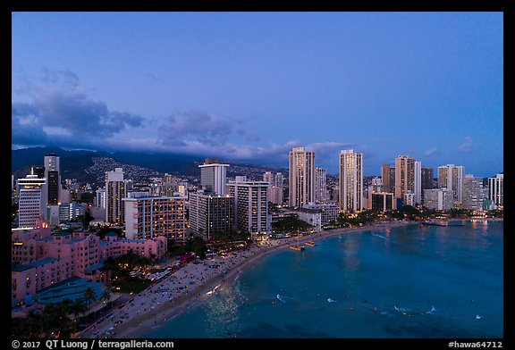 Aerial view of Waikiki Beach and skyline at dusk. Honolulu, Oahu island, Hawaii, USA