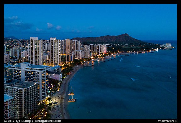 Aerial view of Waikiki Beach, skyline, and Diamond Head at night. Honolulu, Oahu island, Hawaii, USA