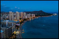 Aerial view of Waikiki Beach, skyline, and Diamond Head at night. Honolulu, Oahu island, Hawaii, USA ( color)