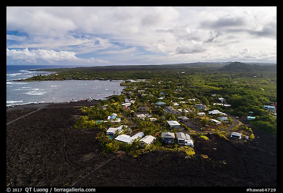Aerial view of residential community on edge of lava field. Big Island, Hawaii, USA