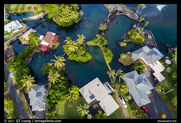 Aerial view of houses and Champagne Ponds. Big Island, Hawaii, USA