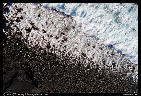 Aerial view of surf and lava rocks looking down, Kaimu Beach. Big Island, Hawaii, USA