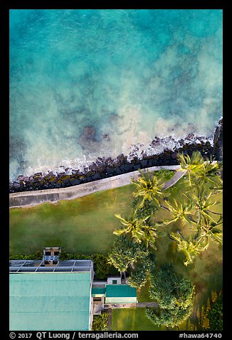 Aerial view of Hulihee Palace, palm trees, and coast looking down. Hawaii, USA