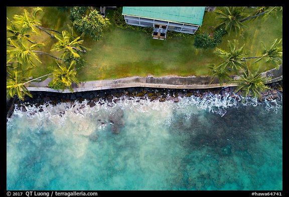 Aerial view of Hulihee Palace, palm trees, and coastline. Hawaii, USA