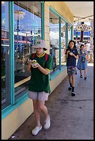 Family walking with Hawaiian Shave Ice, Paia. Maui, Hawaii, USA ( color)