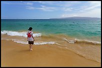 Girl stepping into water, Big Beach. Maui, Hawaii, USA ( color)