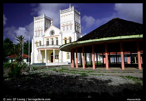 Church and fale in Leone. Tutuila, American Samoa (color)