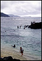 Children playing in water near Fugaalu. Pago Pago, Tutuila, American Samoa