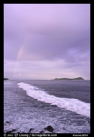 Rainbow at sunset, wave, and Aunuu island. Aunuu Island, American Samoa (color)