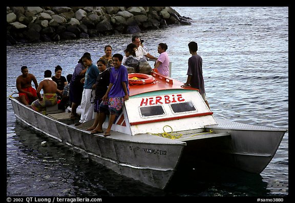 Villagers crowd a ferry to Aunuu. Aunuu Island, American Samoa (color)