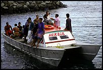 Villagers crowd a ferry to Aunuu. Aunuu Island, American Samoa ( color)