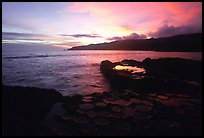 Ancient grinding stones (foaga) and Leone Bay at sunset. Tutuila, American Samoa (color)