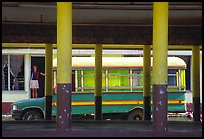 Bus and fale in Masefau village. Tutuila, American Samoa (color)