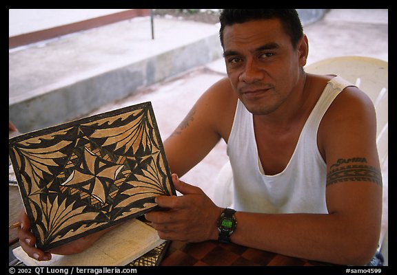 Young man showing an artwork based on traditional siapo designs. Pago Pago, Tutuila, American Samoa
