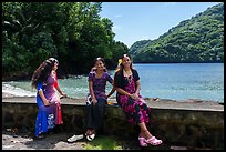 Samoan girls sitting on seawall, Fagasa. Tutuila, American Samoa ( color)