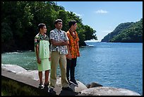 Samoan boys standing on seawall, Fagasa. Tutuila, American Samoa ( color)