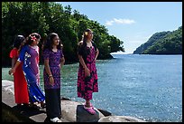 Samoan girls standing on seawall in Fagasa Bay. Tutuila, American Samoa ( color)