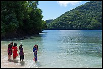 Samoan women standing in water in Fagasa Bay. Tutuila, American Samoa ( color)